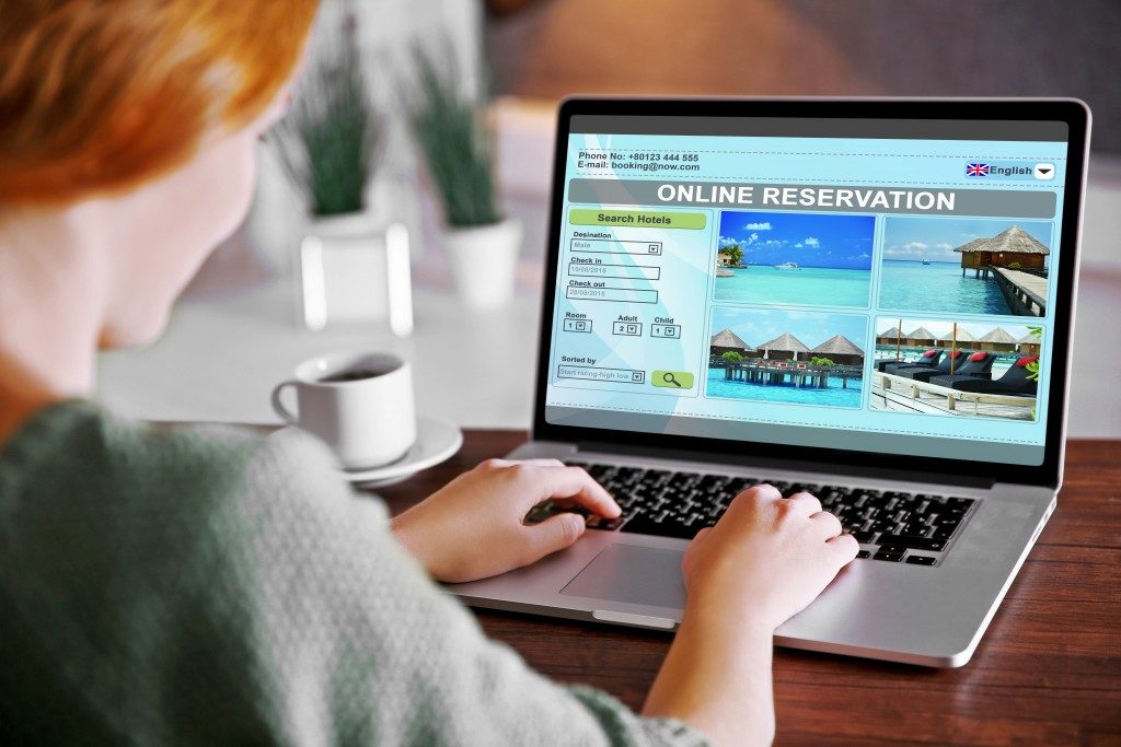 woman booking a hotel room reservation
