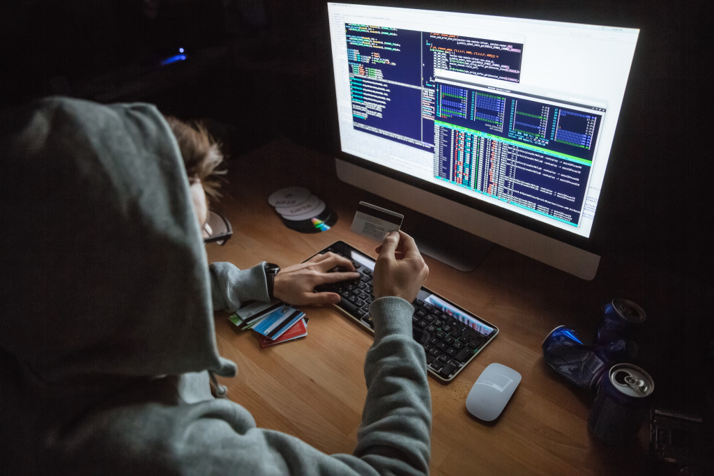 man hacking on a computer