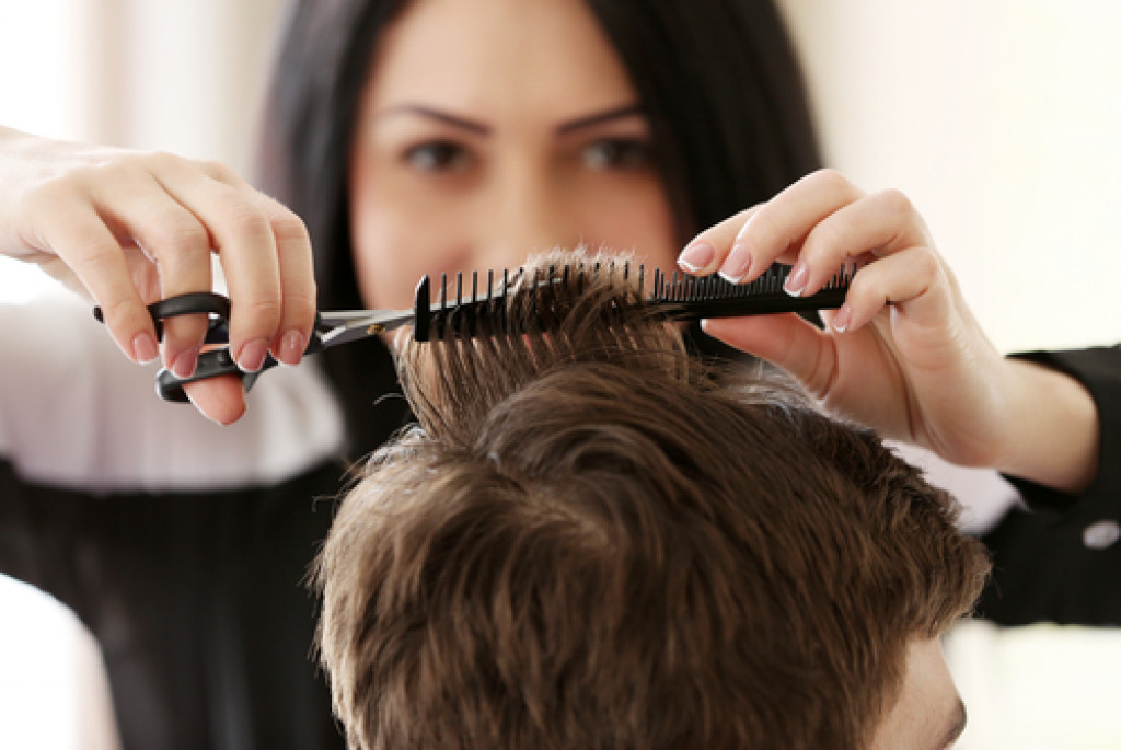 A hairdresser cutting a client's hair