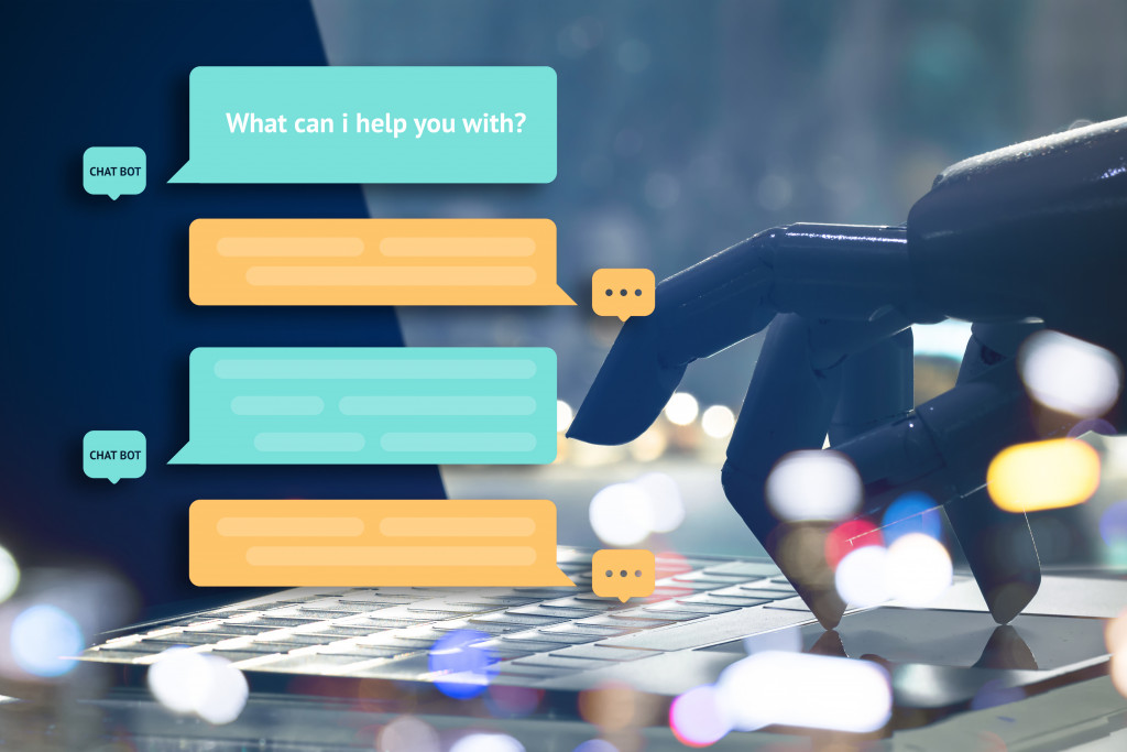 chatbot represented by a robot hand typing