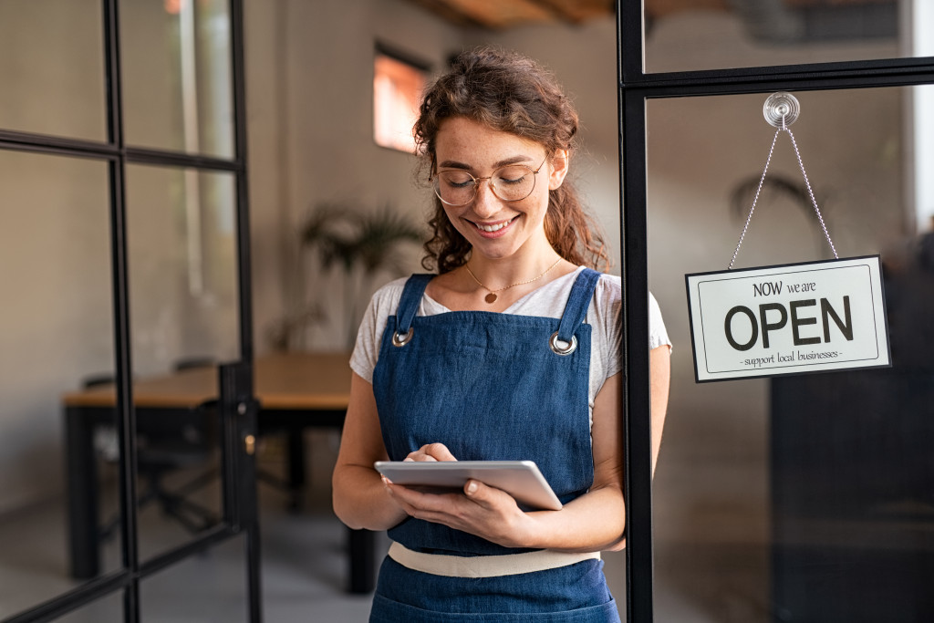 Local business owner in front of business